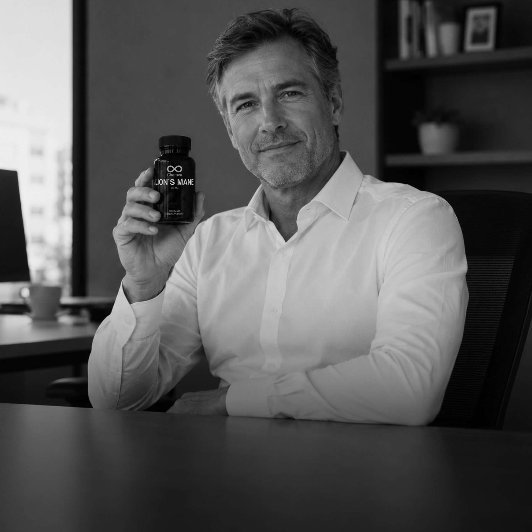 Man holding a bottle of Lion's Mane supplement in an office setting