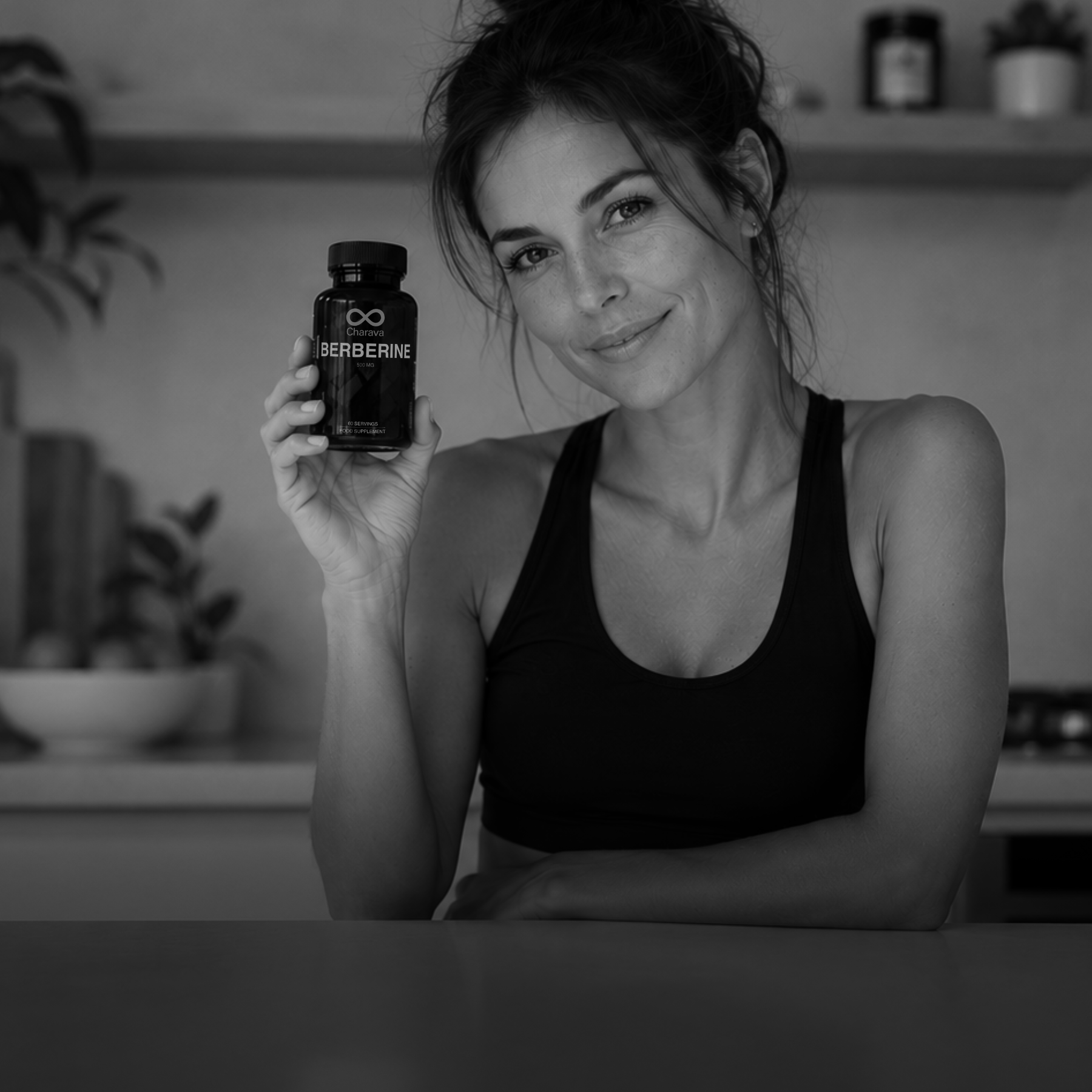 Woman holding a bottle labeled 'Berberine' in a kitchen setting