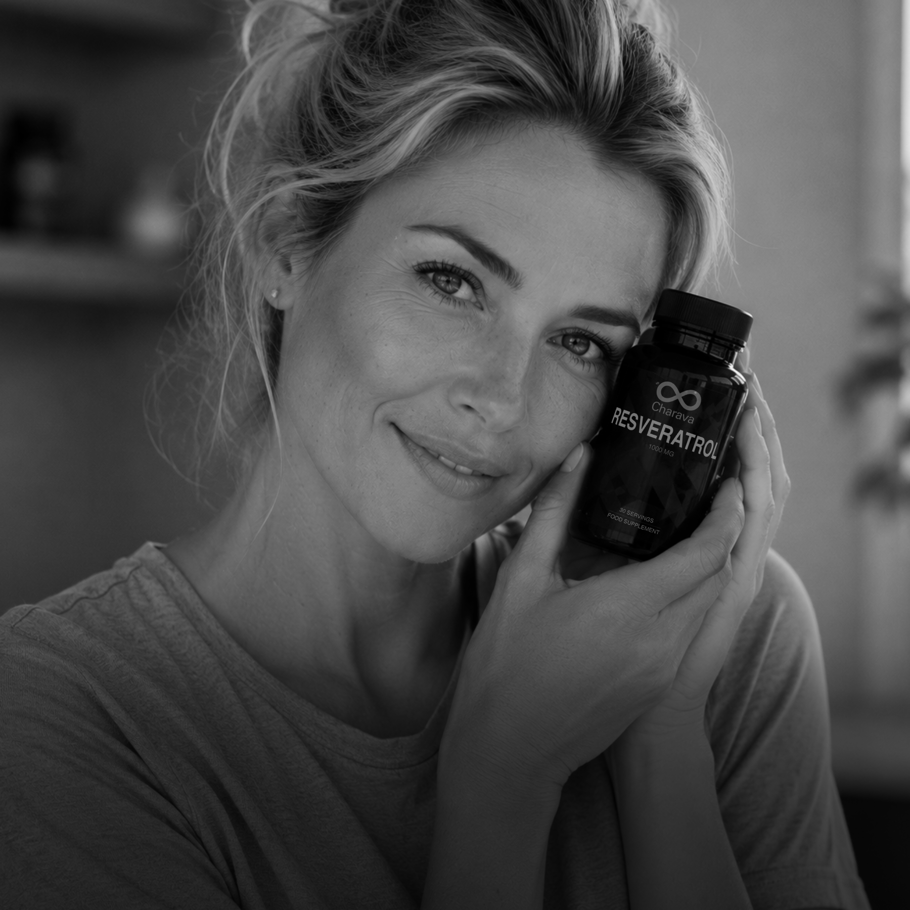 Woman holding a bottle labeled 'Resveratrol' in a blurred indoor setting